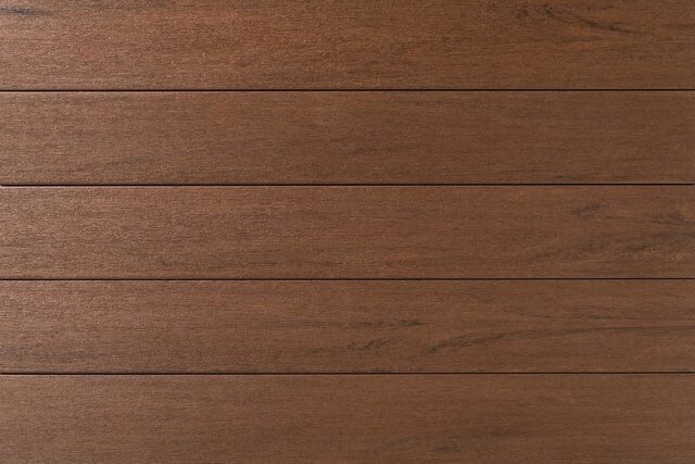 Close-up of TimberTech Porch Collection boards in Mahogany, a rich reddish brown.